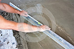 Plasterer concrete worker at floor work