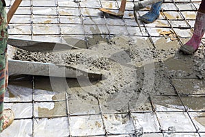 A plasterer concrete worker at floor work
