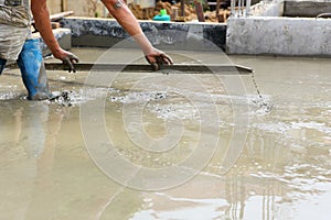 A plasterer concrete worker at floor work