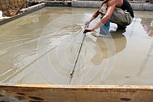 A plasterer concrete worker at floor work