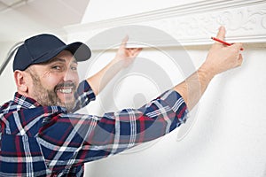 plasterer at indoor ceiling renovation