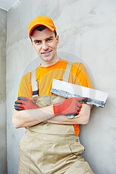 Plasterer at indoor ceiling work