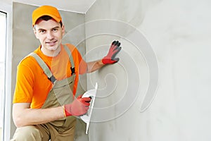 Plasterer at indoor ceiling work