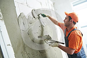 Plasterer putting plaster on wall. slow motion