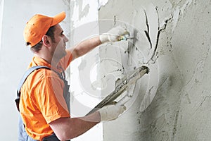 Plasterer putting plaster on wall. slow motion