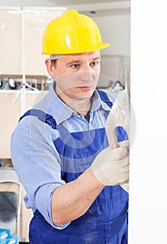 Plasterer working indoors