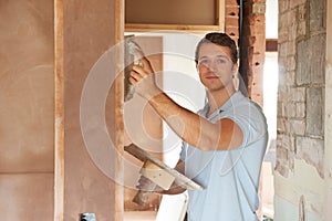 Plasterer Working On Wall