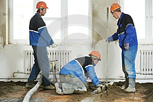 Plasterers concrete worker at floor work