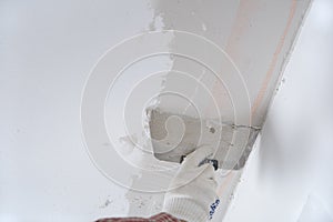 Plastering a ceiling