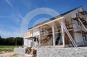 Plastering and Painting House Facade Wall. Install Plastic Siding Soffits and Eaves Exterior