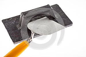 Plastering trowel and surfacer