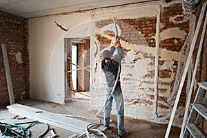 Plastering Walls with a plasterer pump Machine