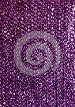 Plastic background texture cellophane wrapping packing wrap packet bead ball color purple violet berry lilac