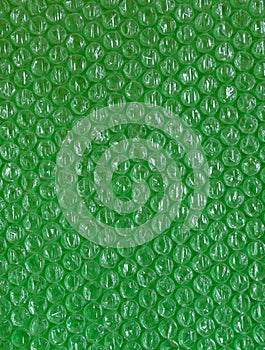 Plastic background texture cellophane wrapping packing wrap packet bead ball green greens ufo tropic brilliant