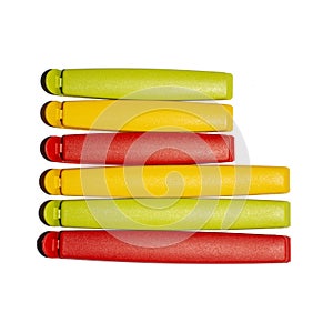 Plastic bag clips on a white background.Colored clothespins for open packages.