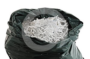 Plastic bag filled with shredded paper