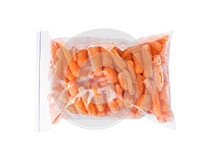 Plastic bag with frozen baby carrots on white background, top view. Vegetable preservation