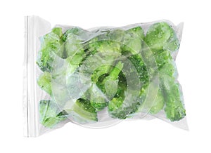 Plastic bag with frozen broccoli on white background. Vegetable preservation