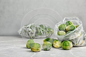 Plastic bag with frozen Brussel sprouts on table
