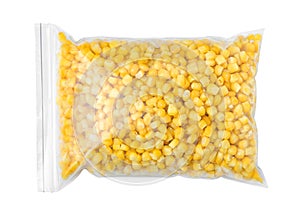 Plastic bag with frozen corn on white background. Vegetable preservation