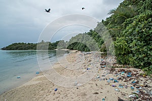 Plastic bags and plastic bottles at the beach a the tropical island