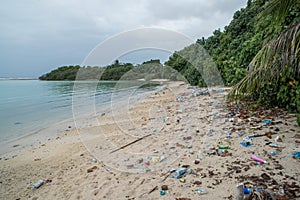 Plastic bags and plastic bottles garbage at the beach a the tropical island