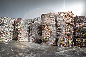 Plastic bales of rubbish at the waste treatment processing plant. Recycling separatee and storage of garbage for further disposal