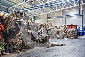 Plastic bales at the waste processing plant. Separate garbage collection. Recycling and storage of waste for further disposal.