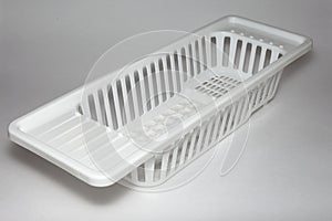 plastic basket for washing dishes on the sink. washing dishes. isolated white