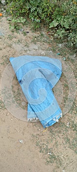 A plastic beg of blue colour on road