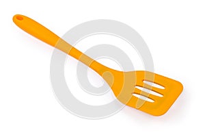 Plastic bendable kitchen spatula on a white background