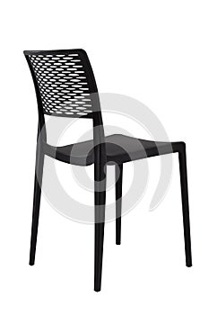 Plastic black chair with a wicker back. Patio or cafe furniture.