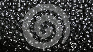 Plastic black gray granulated crumb. Manufacture of plastic water pipes factory. Process of making plastic tubes on the