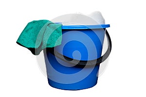 Plastic blue water bucket with soapsuds and black handle and green rag