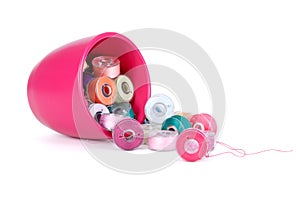 Plastic bobbins with thread of different colors