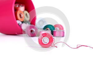 Plastic bobbins with thread of different colors