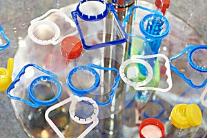 Plastic bottle caps and cap holders