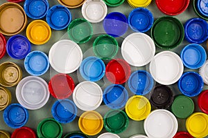 Plastic bottle caps for recycling. Top view.