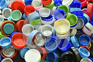 Plastic bottle caps or tops background, recycling concept.