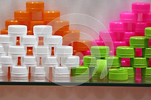 Plastic bottle caps ; white green pink orange colors