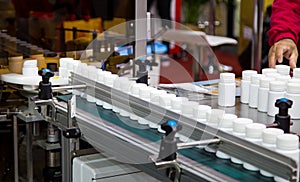 Plastic bottle on capsule filling machine conveyor belt