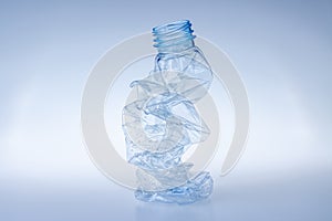 Plastic bottle crushed for recycling