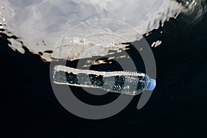 Plastic Bottle Drifting in Ocean photo