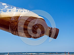 Plastic bottle of drink, blue sky, global environment conservation concept