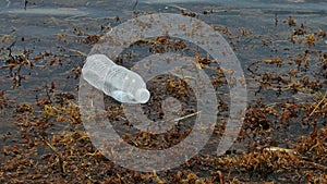 Plastic bottle floating in the ocean