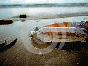 Plastic bottle or Garbage on the Beach in high travel season