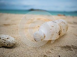 Plastic bottle or Garbage on the Beach