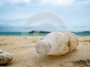 Plastic bottle or Garbage on the Beach