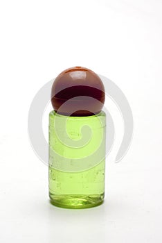 Plastic bottle with green liquid