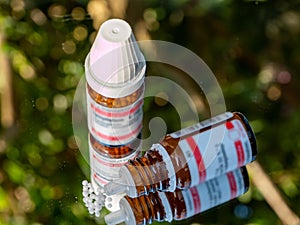 plastic bottle with homeopathic globule photo